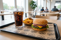 Custom branded tray liner in use on restaurant serving tray by PaperLei